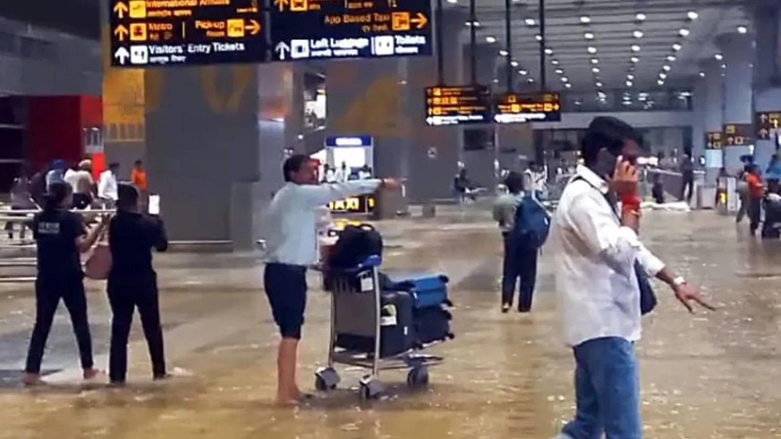 Heavy Rain Causes Waterlogging at Delhi Airport Gates